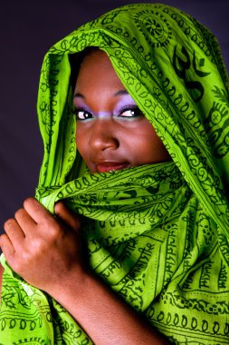 Shy African woman with scarf clipart