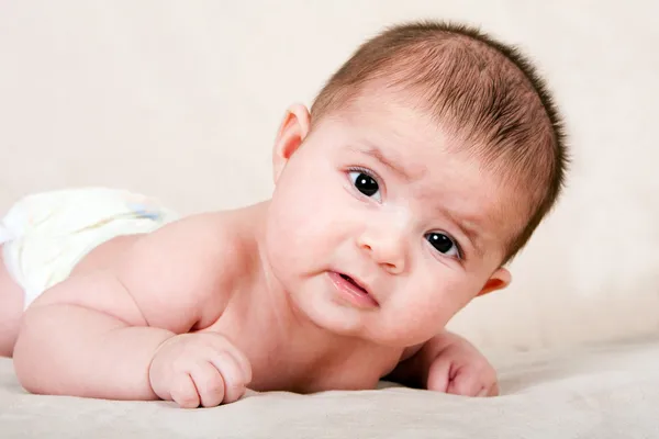 Baby laying on belly — Stock Photo, Image