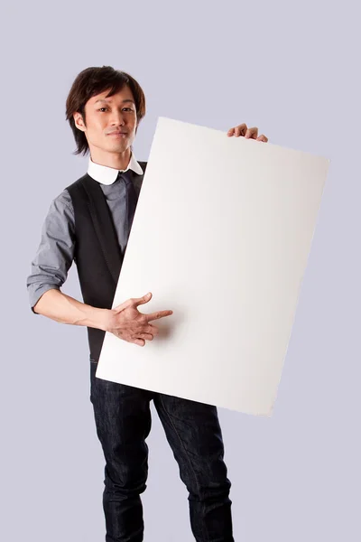 Asian business man pointing at board — Stock Photo, Image