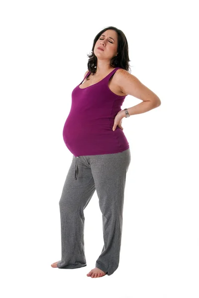 Беременная женщина с болью в спине — стоковое фото