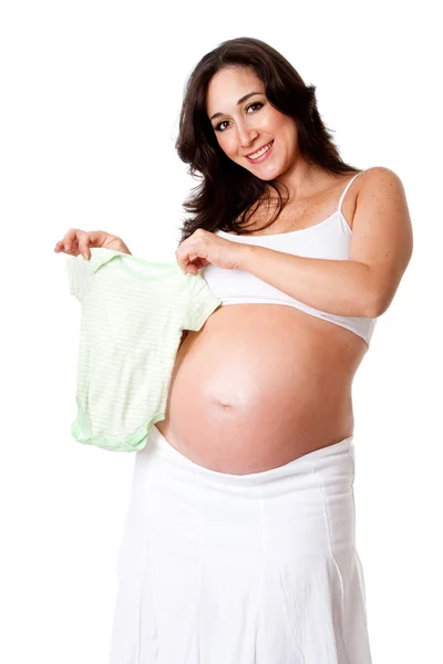 Mulher grávida segurando macacão bebê — Fotografia de Stock