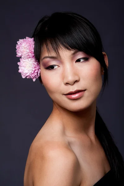 stock image Face of Asian woman with flowers