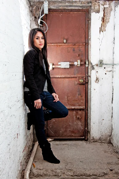 Stock image Girl in front of door