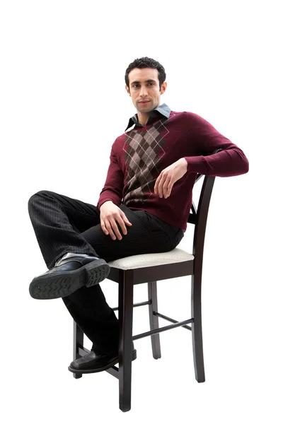 Bonito homem de negócios sentado na cadeira — Fotografia de Stock