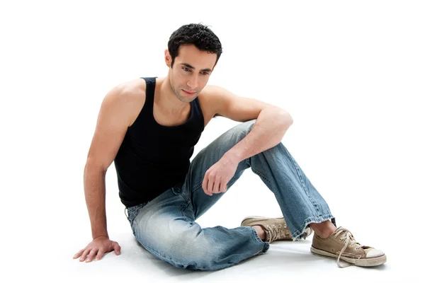 Handsome guy sitting on floor — Stock Photo, Image