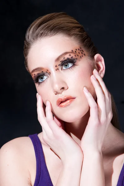 Beatiful face with Leopard print eyes — Stock Photo, Image