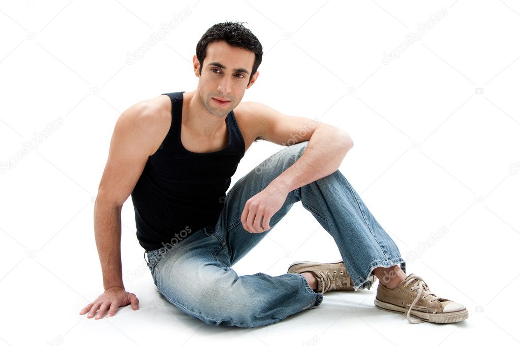 Handsome guy sitting on floor
