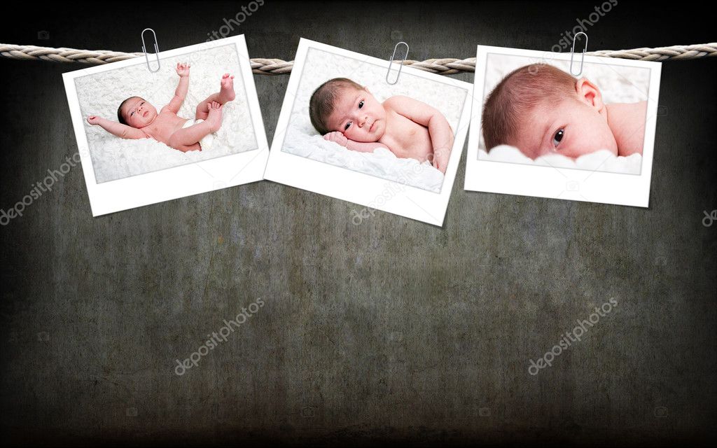 Cute baby photos hanging on rope