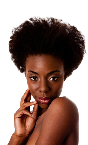 Beautiful face of an African American woman with Afro curly hair, hand, bare shoulders and smooth brown skin, isolated.