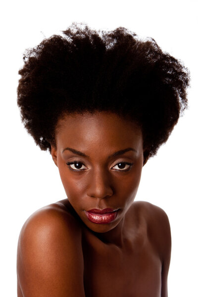 Beautiful face of an African American woman with Afro curly hair, bare shoulders and smooth brown skin, isolated.