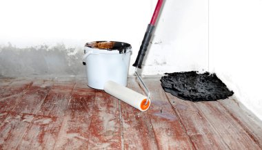 Home rennovation - flattening the floor with hydroisolating mast clipart