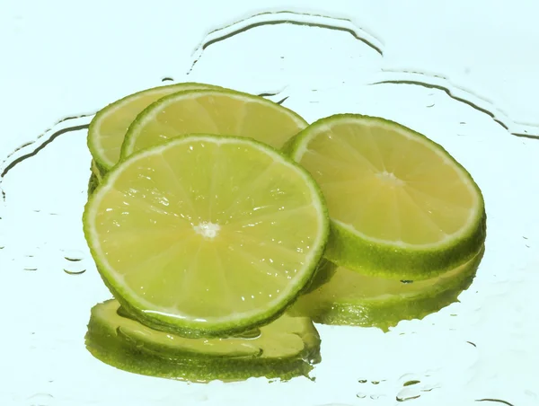 Lime in water — Stock Photo, Image