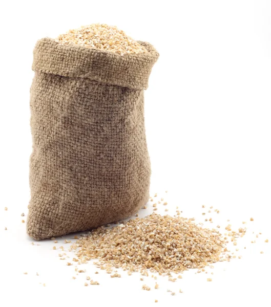 Saco pequeno de grãos de trigo — Fotografia de Stock