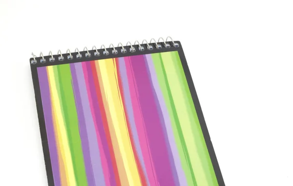 Caderno colorido com uma mola — Fotografia de Stock