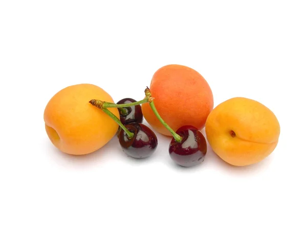 Apricots and cherries. — Stock Photo, Image