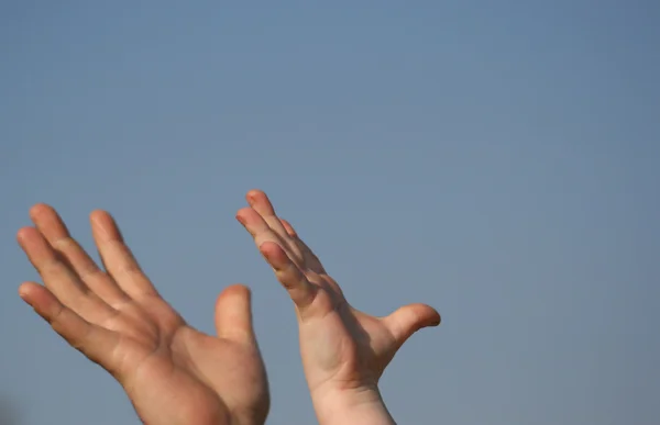 stock image Father and son arms on sky background