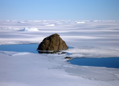 Peak in the ice of Antarctica clipart