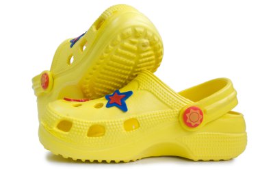 Kid's yellow rubber sandals. clipart