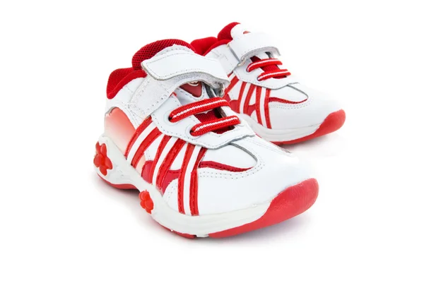 Kırmızı-beyaz çocuk ayakkabıları eğitim. — Stok fotoğraf