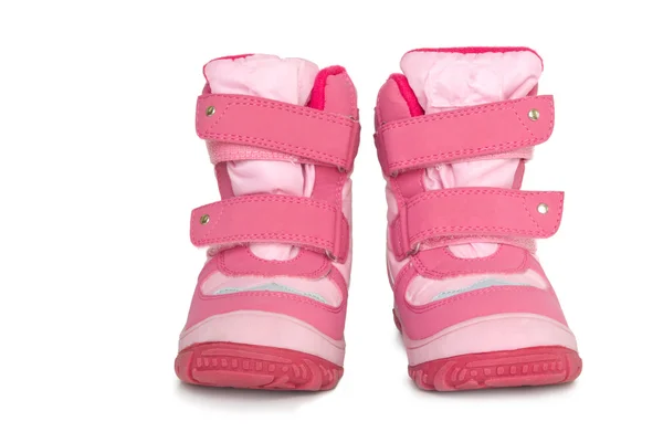 Теплые ботинки розового ребенка — стоковое фото
