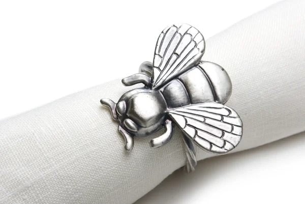 Napkin with a ring in the form of a fly. — Stock Photo, Image