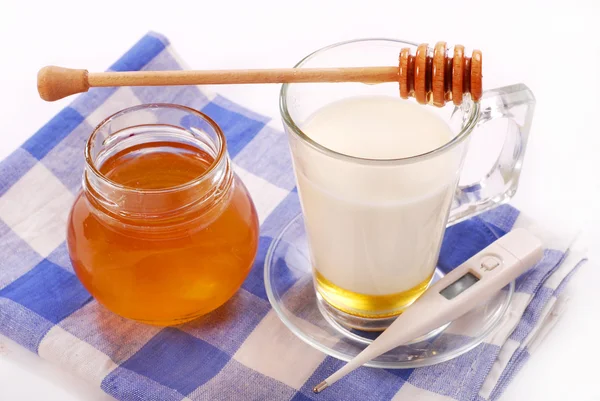 Mjölk med honung Stockbild