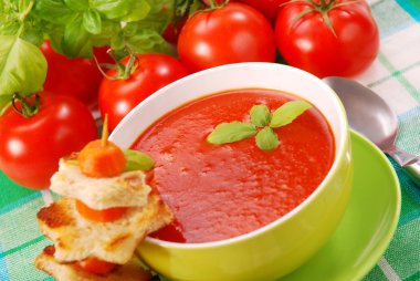 Tomato cream soup with croutons clipart