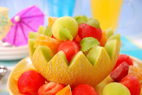 Fruits salad in melon bowl — Stock Photo, Image