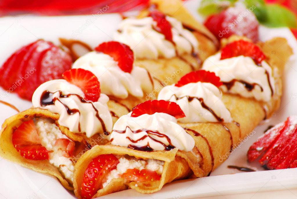 Pancakes with ,cream and strawberry
