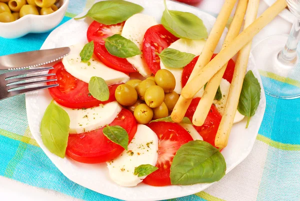 Caprese salad with grissini — Stock Photo, Image