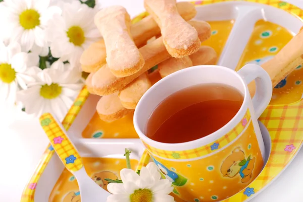 Tea and sponge fingers for child — Stock Photo, Image