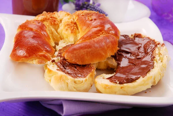 Croissant with chocolate cream — Stock Photo, Image