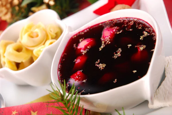 Red borscht with mushroom ravioli for christmas eve — Stock Photo, Image
