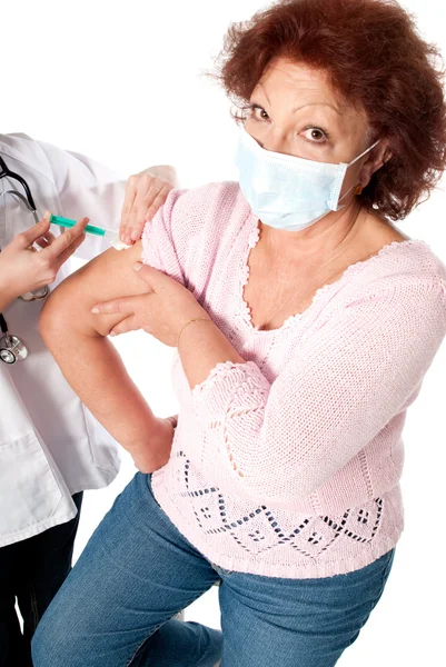 Senior woman getting flu vaccine — Stock Photo, Image