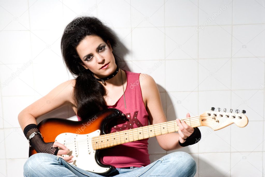 Female playing electric guitar