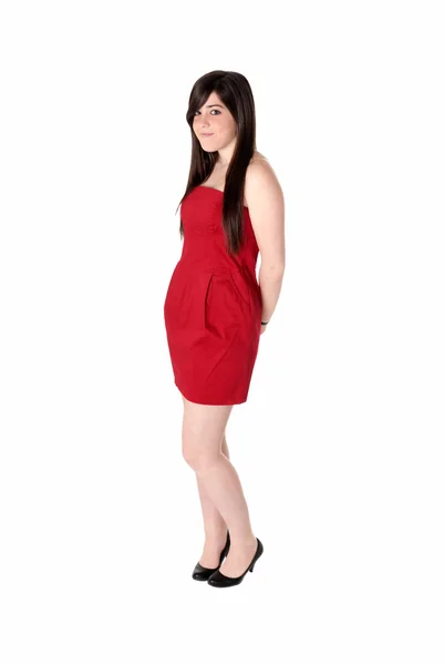 Giovane donna bella con abito rosso isolato su bianco . — Foto Stock