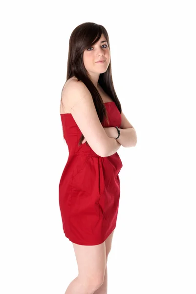 Ung vacker flicka med röd klänning står isolerat på vit bakgrund. — Stockfoto