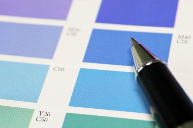 A pen and blue process color chart clipart