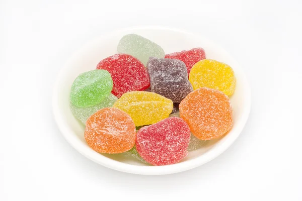 Barevné bonbóny s cukrem na vrcholu — Stock fotografie