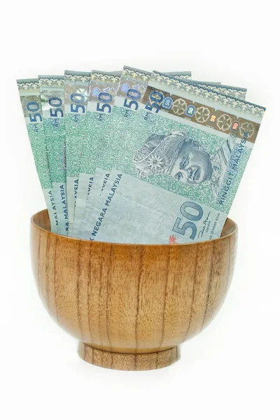 Malaysian Ringgit in a Wooden Bowl — Stock Photo, Image
