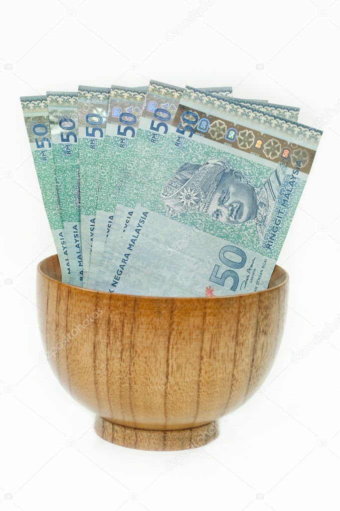 Malaysian Ringgit in a Wooden Bowl