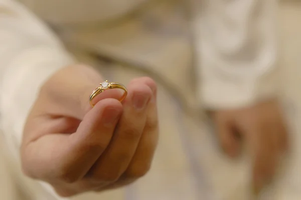 stock image Mans Hand Holding a Wedding Ring