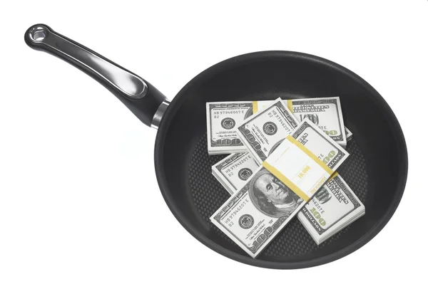 stock image Stack of dollars in a skillet