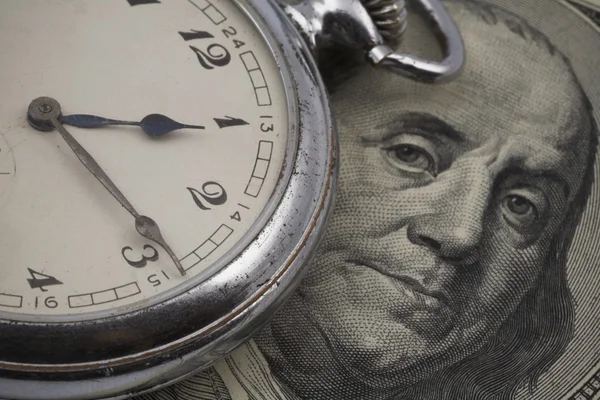 Pocket watch on US currency — Stock Photo, Image