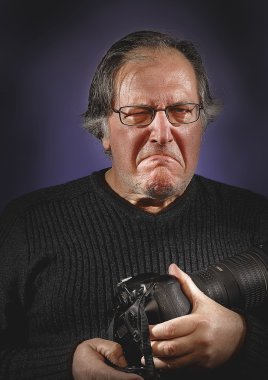 Old freelance photographer suspicious of clipart