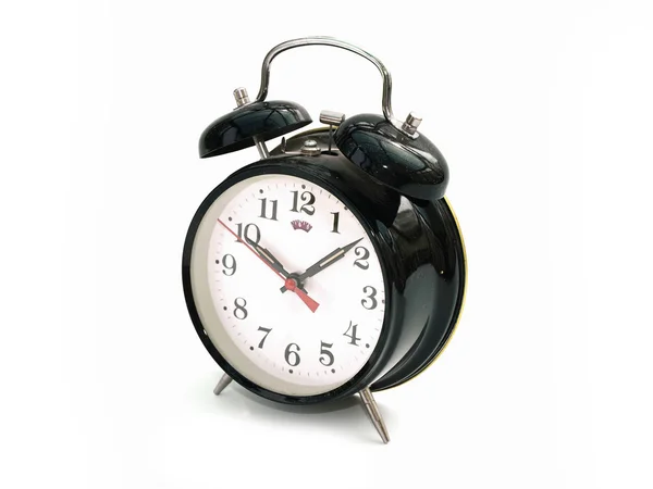 Vintage relógio de alarme empoeirado contra um whit — Fotografia de Stock