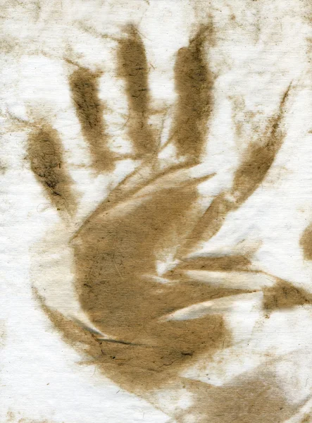 Vuile bruin hand afdrukken tegen ruwe pap — Stockfoto