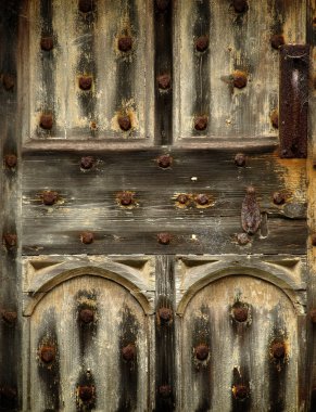 Old rusty wooden gothic door detail clipart