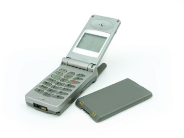 Old mobile phone with its battery clipart