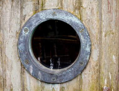 An old rusty ship port hole clipart